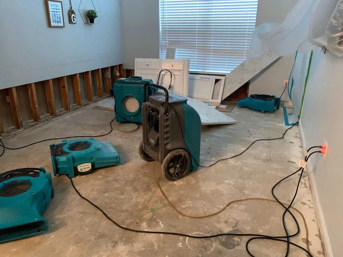 Dehumidifier in flood-cut room for Water Damage Restoration in Detroit